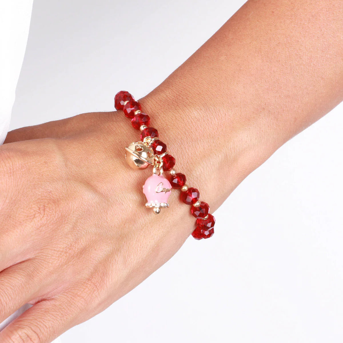 Bracciale in Metallo campanella rosa e piccolo sonaglio con pietre rosse